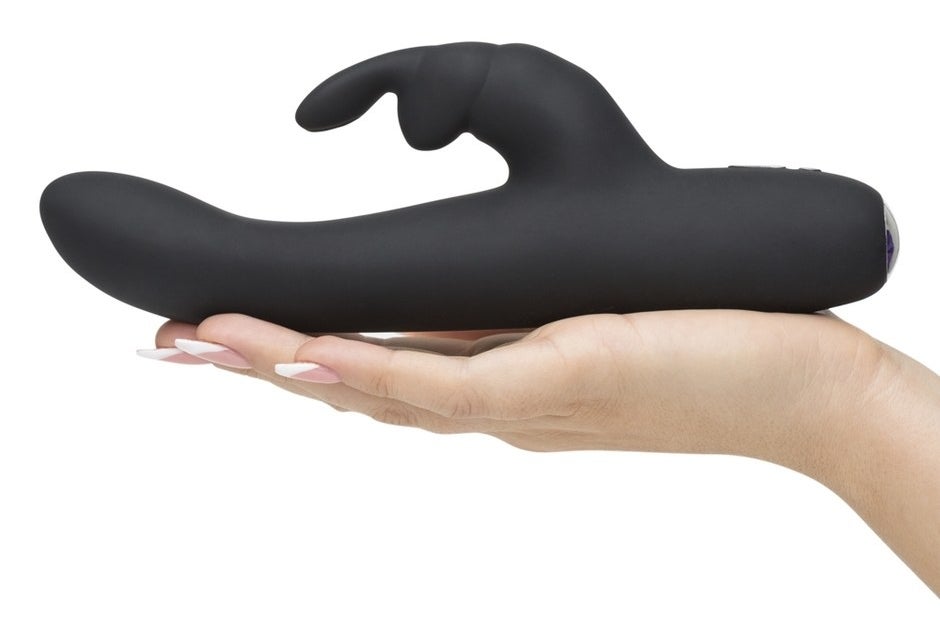 person holding the vibrator in their hand, slightly bigger than their hand