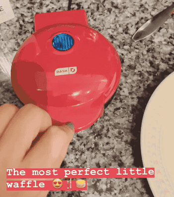 gif of red mini waffle maker being opened labeled 
