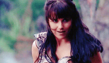 Xena from &quot;Xena: Warrior Princess&quot; smiles wide in preparation for battle