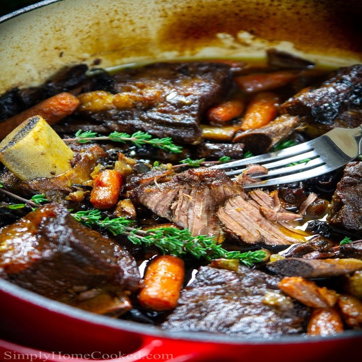 A Dutch oven filled with fork-tender braised short ribs.