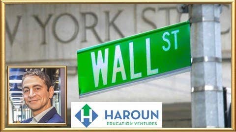 The Wall Street street sign next to a picture of Haroun