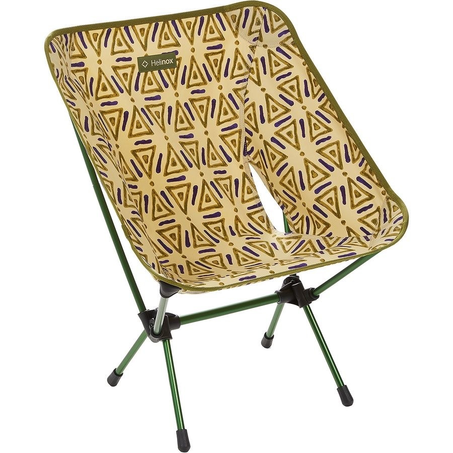 The chair with a green and purple triangular pattern on the seat and a green frame
