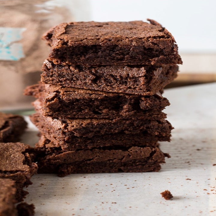 A stack of gooey, chocolate homemade brownies.
