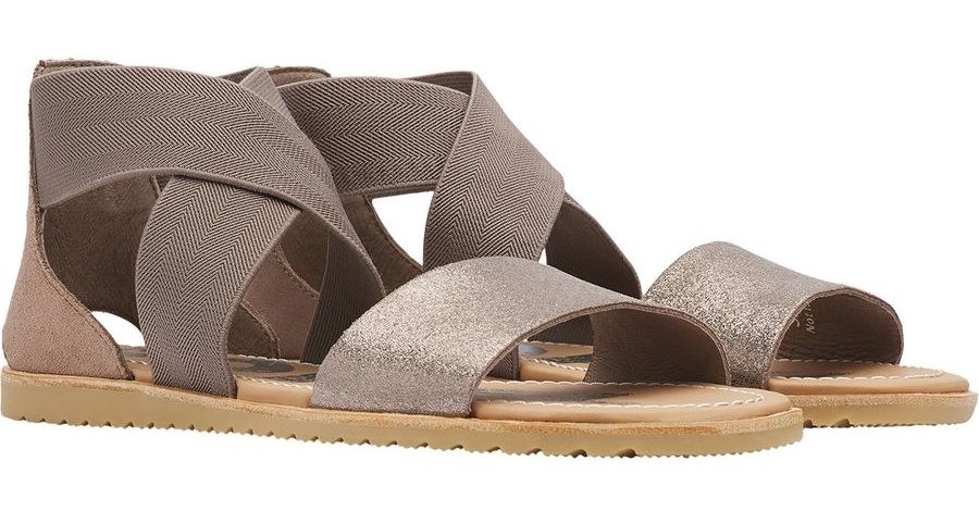 The sandals with taupe crisscross ankle straps and a metallic strap across the toe area
