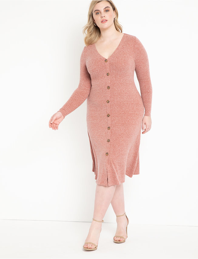 A model wearing the long-sleeve dress in pink with cream heels