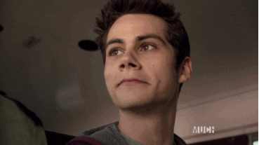 Stiles from Teen Wolf giving a slow, mischievous smile