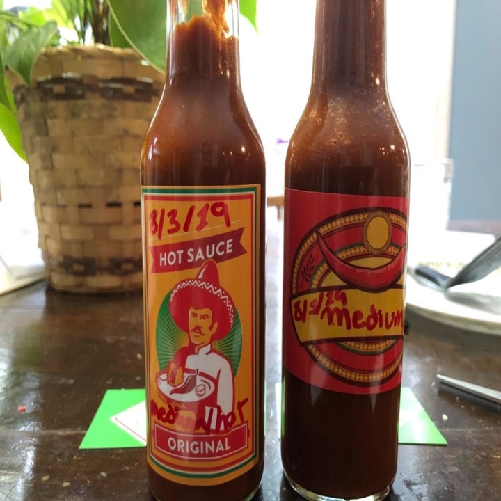 Two bottles of hot sauce that the same reviewer made 