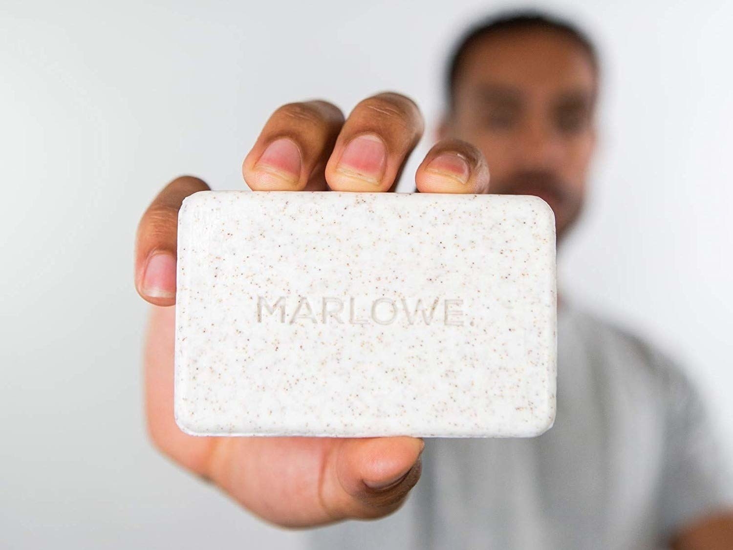 Model holding the soap 