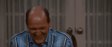 Richard Jenkins as Dr. Robert Doback excitedly waving his hands in the film Step Brothers