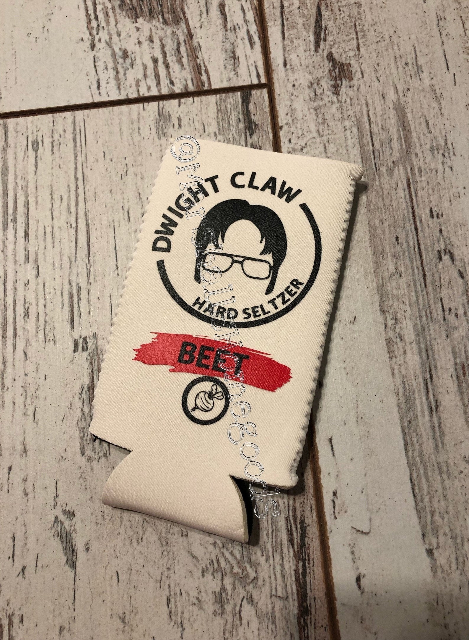 A sleeve that says &quot;Dwight Claw Hard Seltzer&quot; 