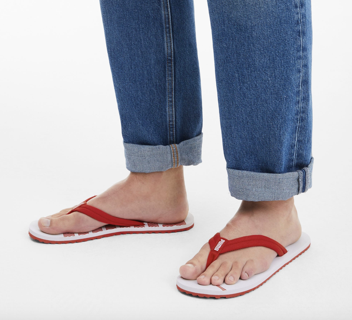 The sandals in red and white on feet