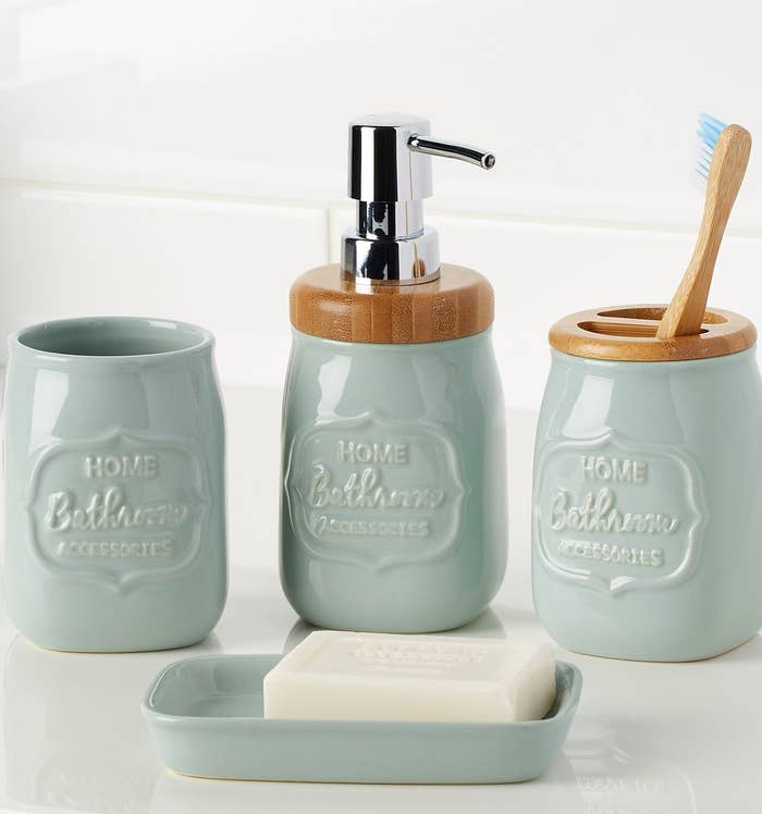 A set of ceramic jars that look like Mason jars and a soap dish 
