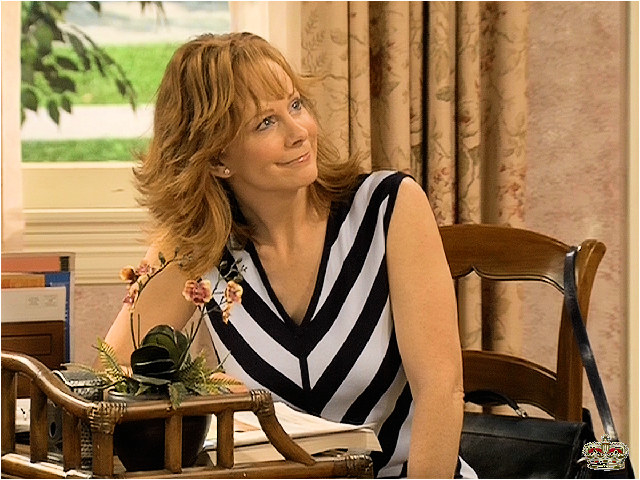 Reba with a warm smile on her face