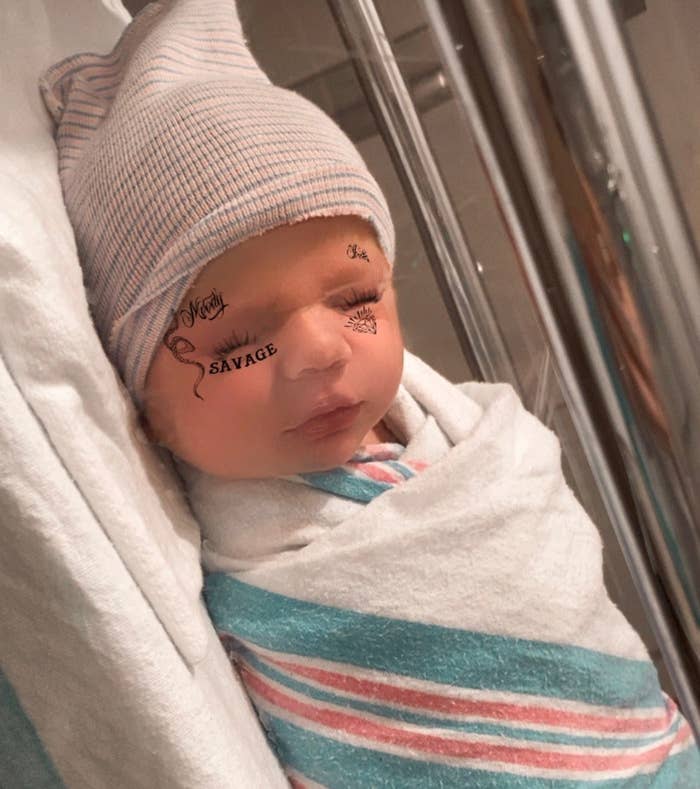 A picture of Elon Musk&#x27;s newborn with a face tattoo filter that Musk posted on Twitter 