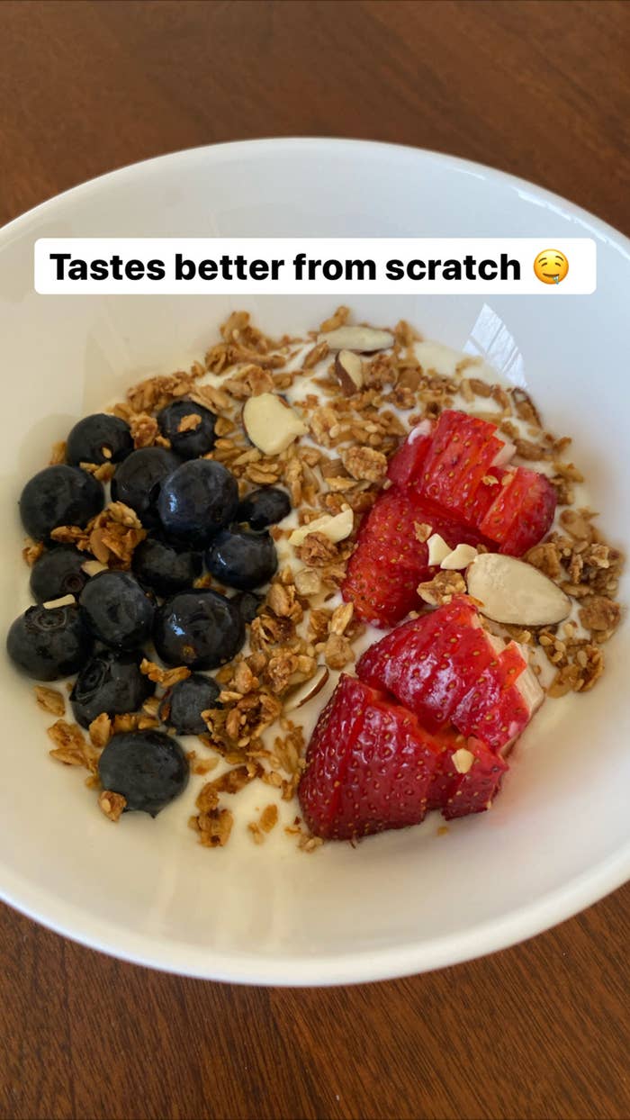 A bowl of homemade yogurt with granola and fresh berries.