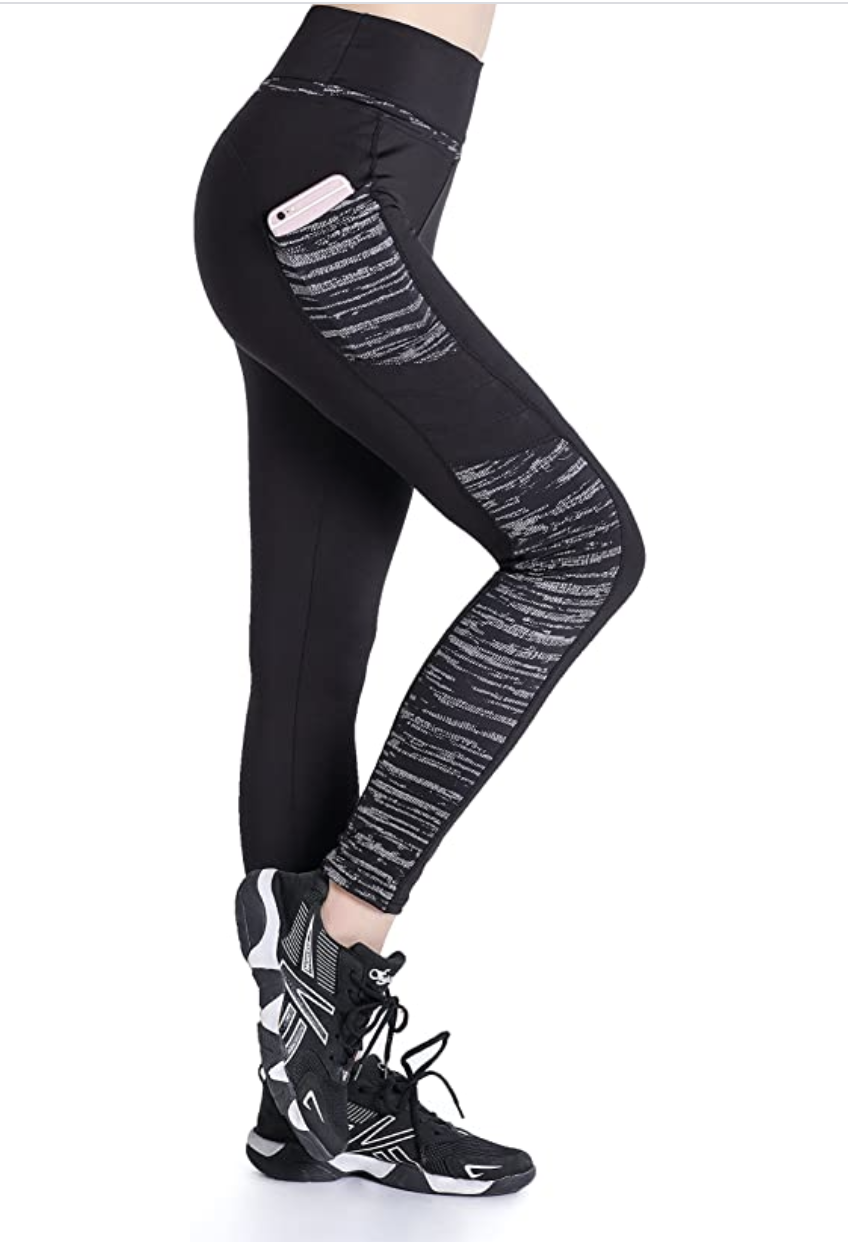 Model wearing black leggings from the side with pocket and marbled black and white design down the leg