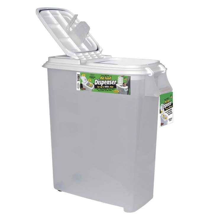 a clear container with two wheels on one side and a flip top opening to dispense food out of
