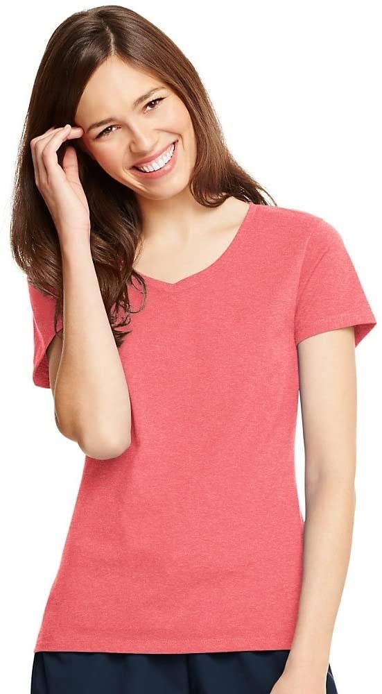 model wearing coral V-neck shirt