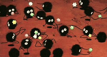 tiny soot sprite creatures from spirited away carrying star candies 