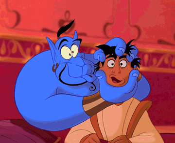 the genie playfully squeezing aladdin&#x27;s face to make him look like he&#x27;s talking