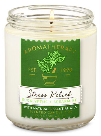 the candle jar with a label that says "stress relief" on it