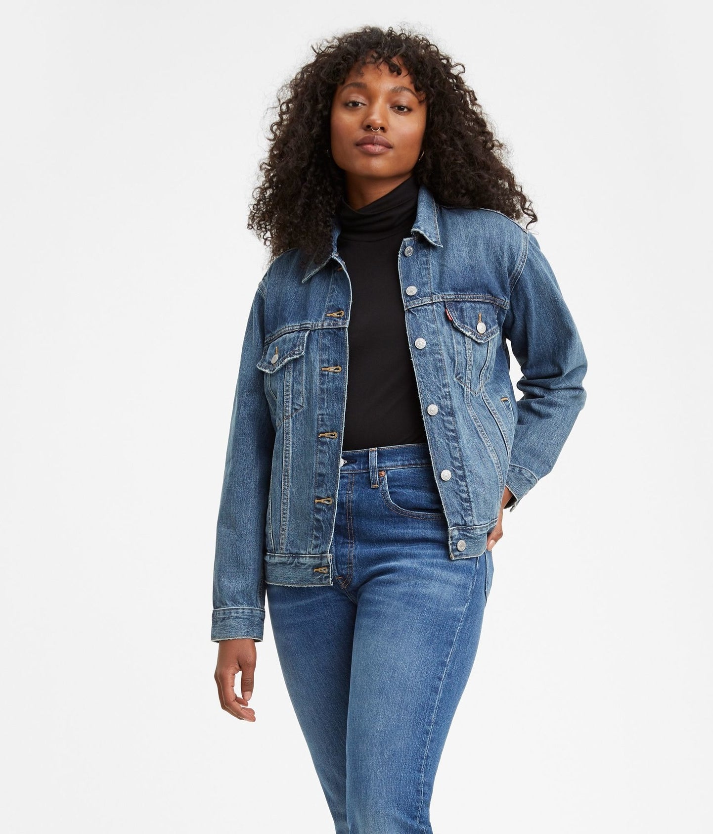 Model wearing the jacket with jeans and a black top