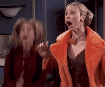 Gif of Friends characters Rachel and Pheobe jumping up and down and clapping