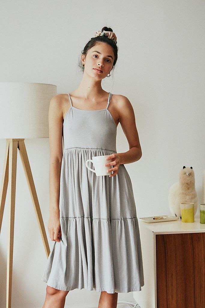 Model wearing the dress in gray 