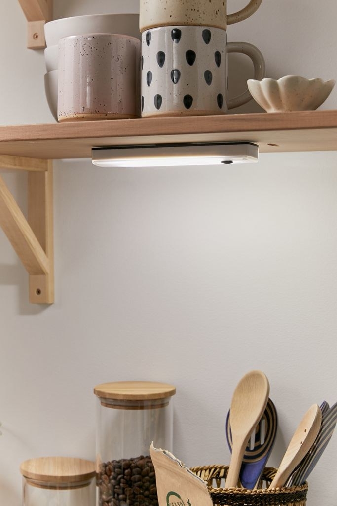 Thin rectangle light under a cabinet in a kitchen