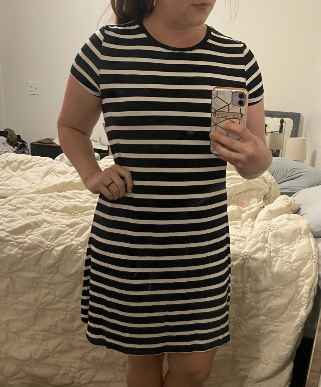 reviewer wearing striped mini dress