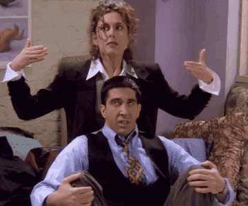 A gif of Ross and Susan from the show Friends taking deep breathes. 
