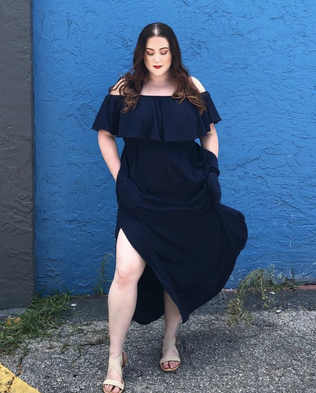 reviewer wearing the dress in navy blue 