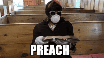 A gif of Robert E Blackmon in a church wearing a mask and pulling it down to say, &quot;Preach.&quot; 