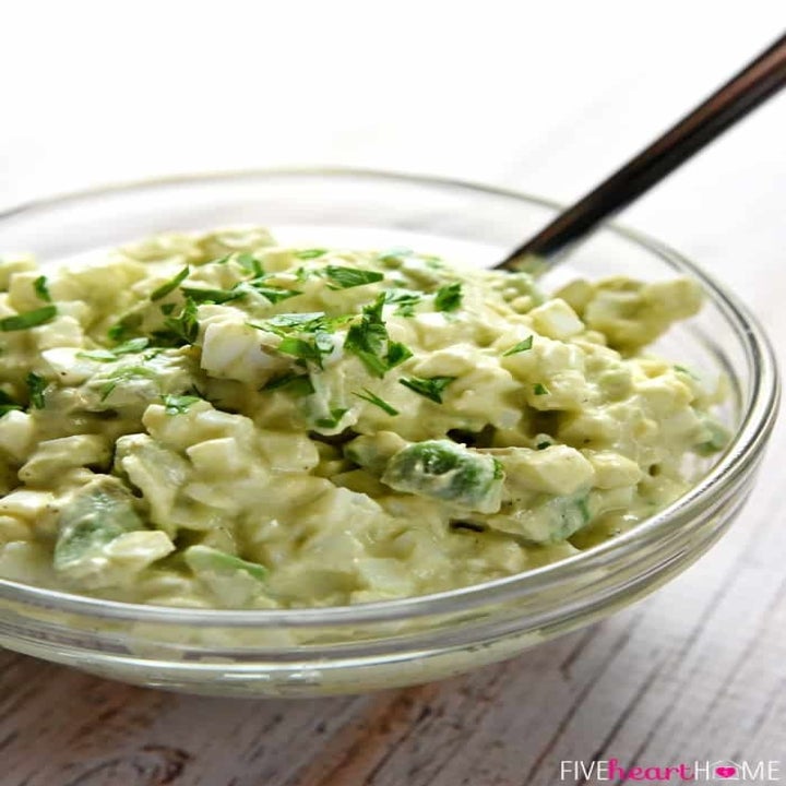 A bowl of egg salad with avocado.