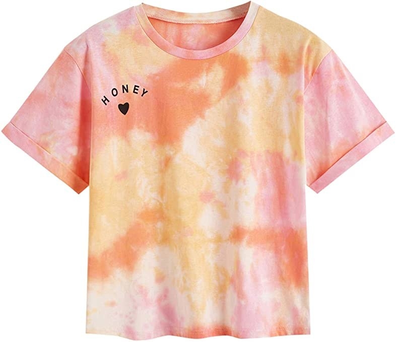 the shirt in green and pink tie-dye with &quot;HONEY&quot; written on breast
