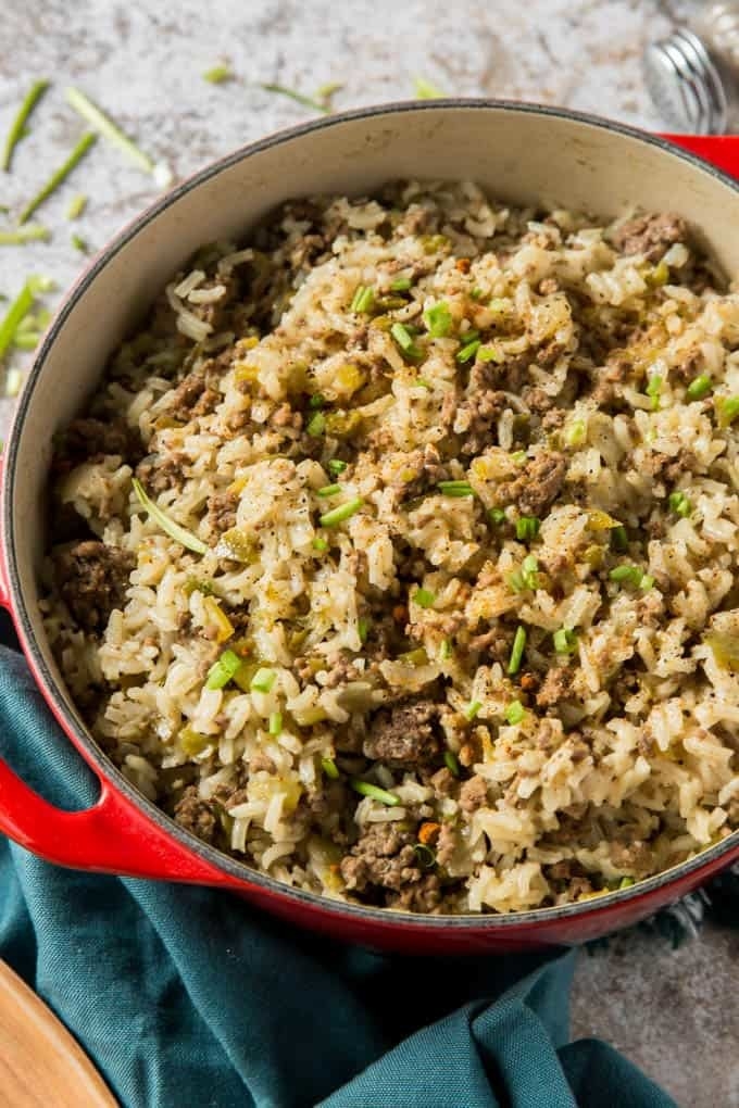 A big pot of rice with ground beef and vegetables.