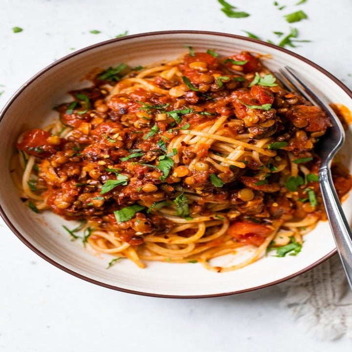 A bowl of lentil and spaghetti Bolognese.