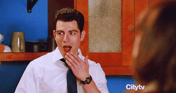 Schmidt and Nick from &quot;New Girl&quot; making surprised, excited faces