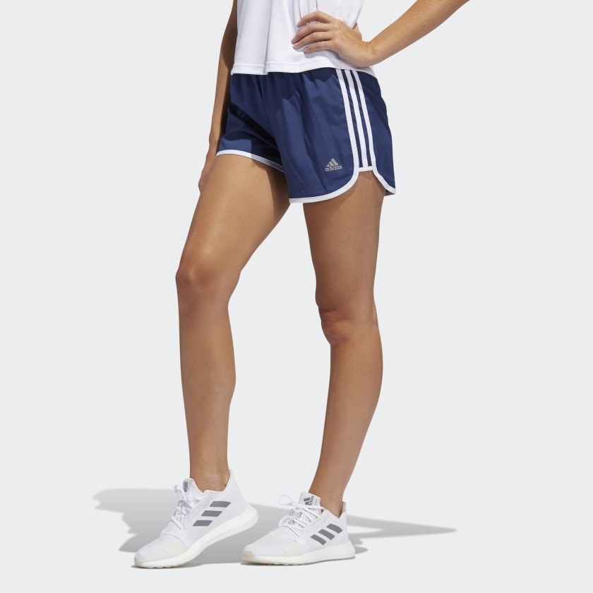 Model wearing the shorts in blue with white lining