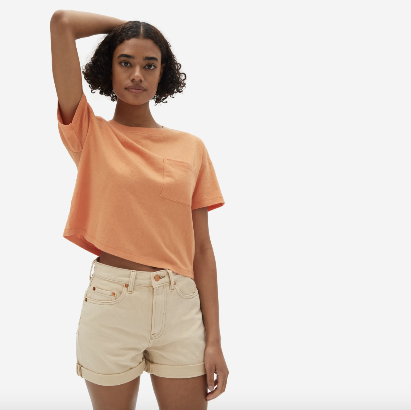 Model wearing the top in melon with shorts