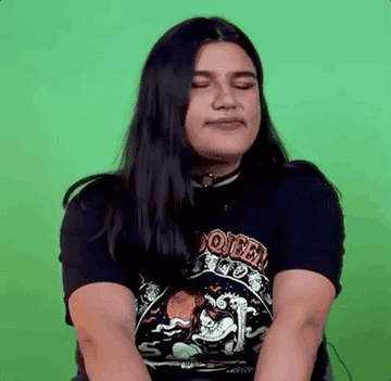 Girl with cropped black hair making a face and saying &quot;what the fuck&quot;