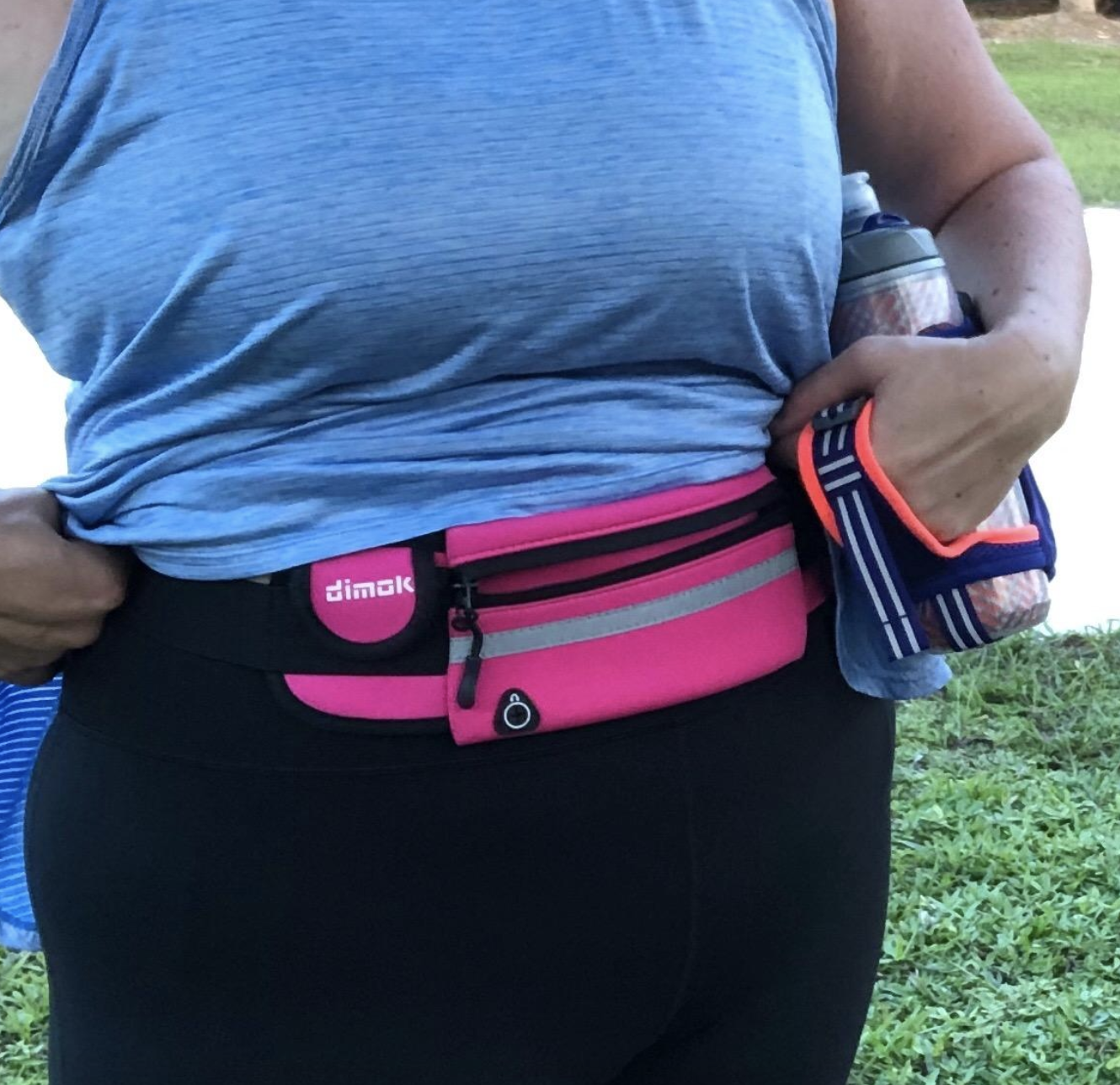 reviewer wearing the belt in pink 