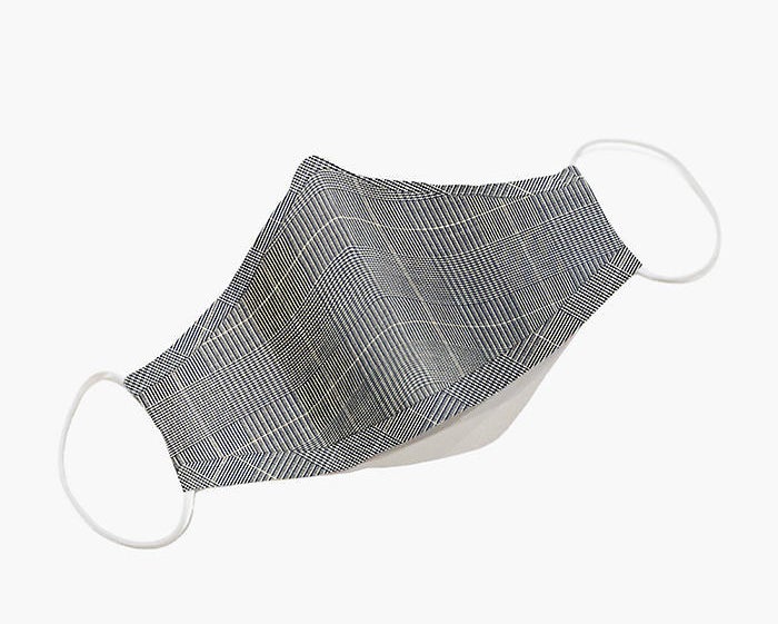 a grey plaid mask with white elastic ear bands