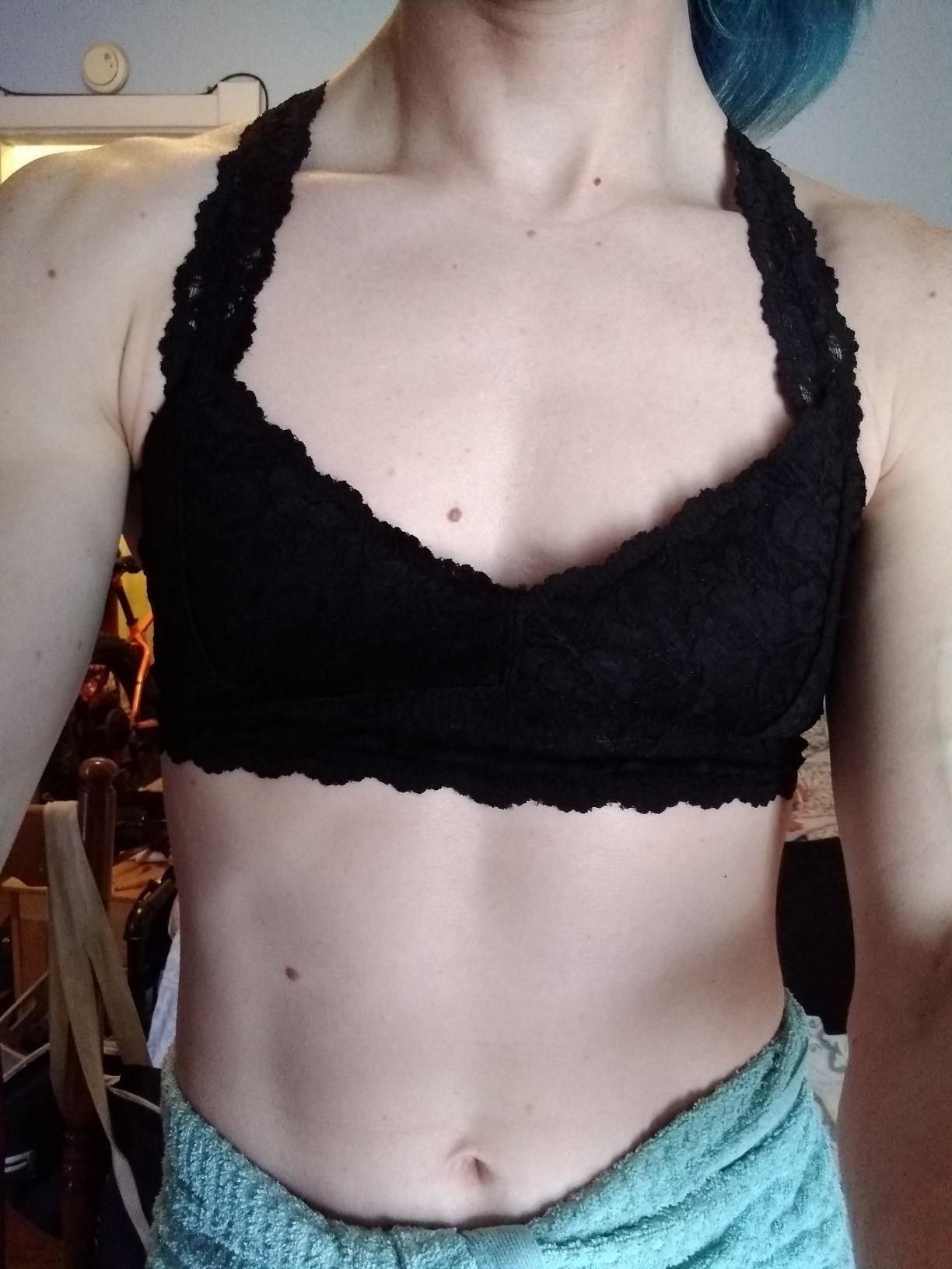 Reviewer wearing black lace V-neck racerback bralette