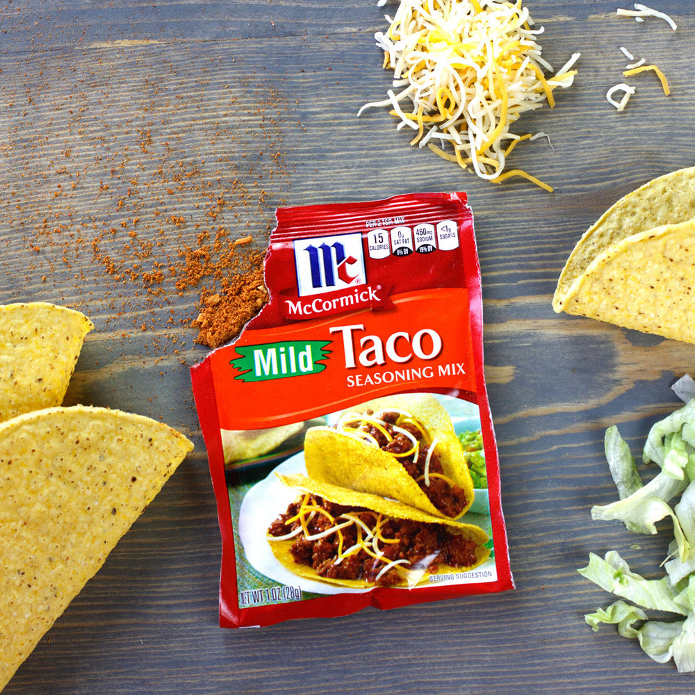 A torn-open package of McCormick taco seasoning and taco shells