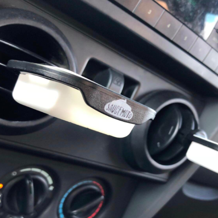 review photo of the dip clip attached to their car vent