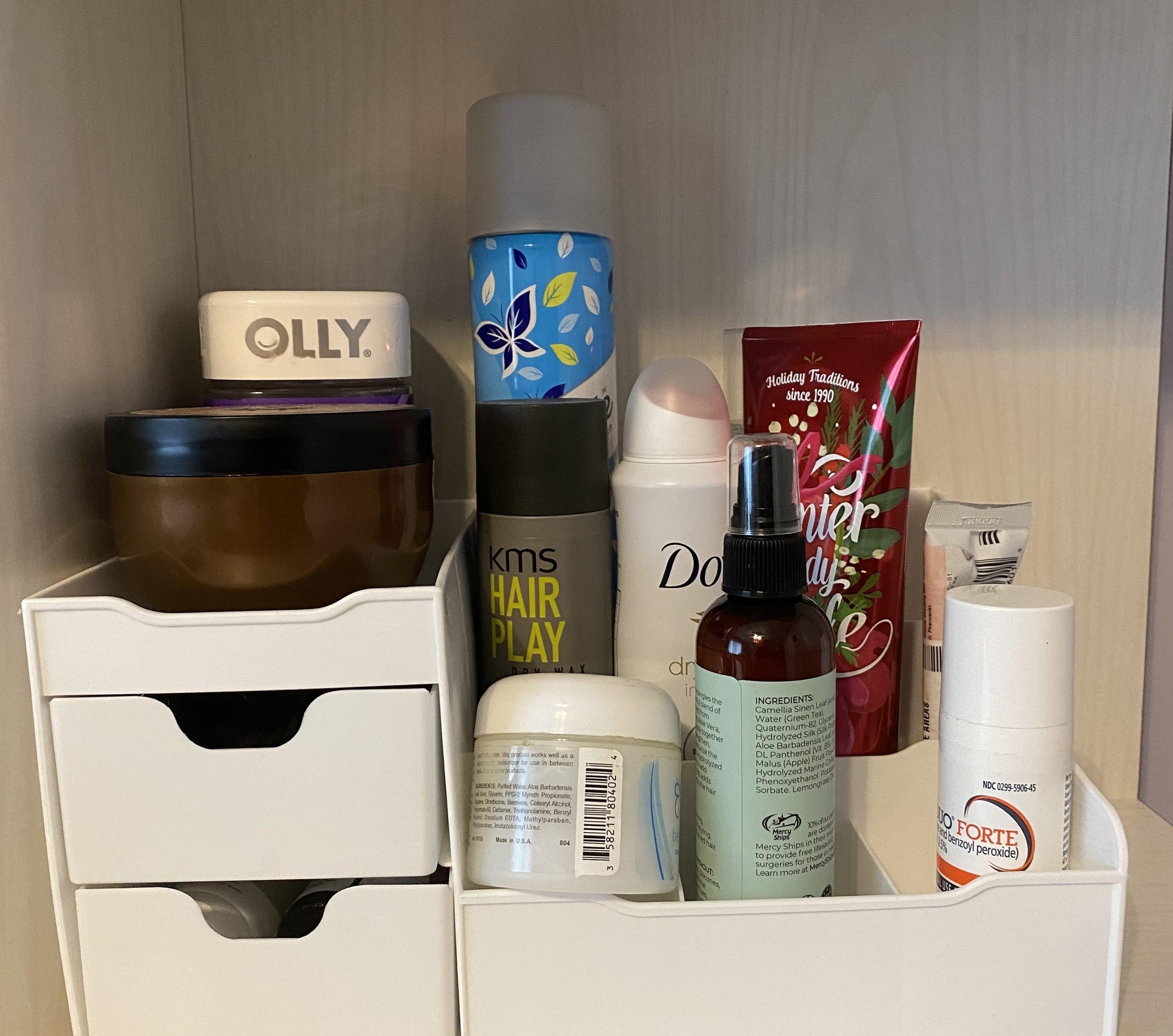 The vanity organizer with skincare and hair products on it