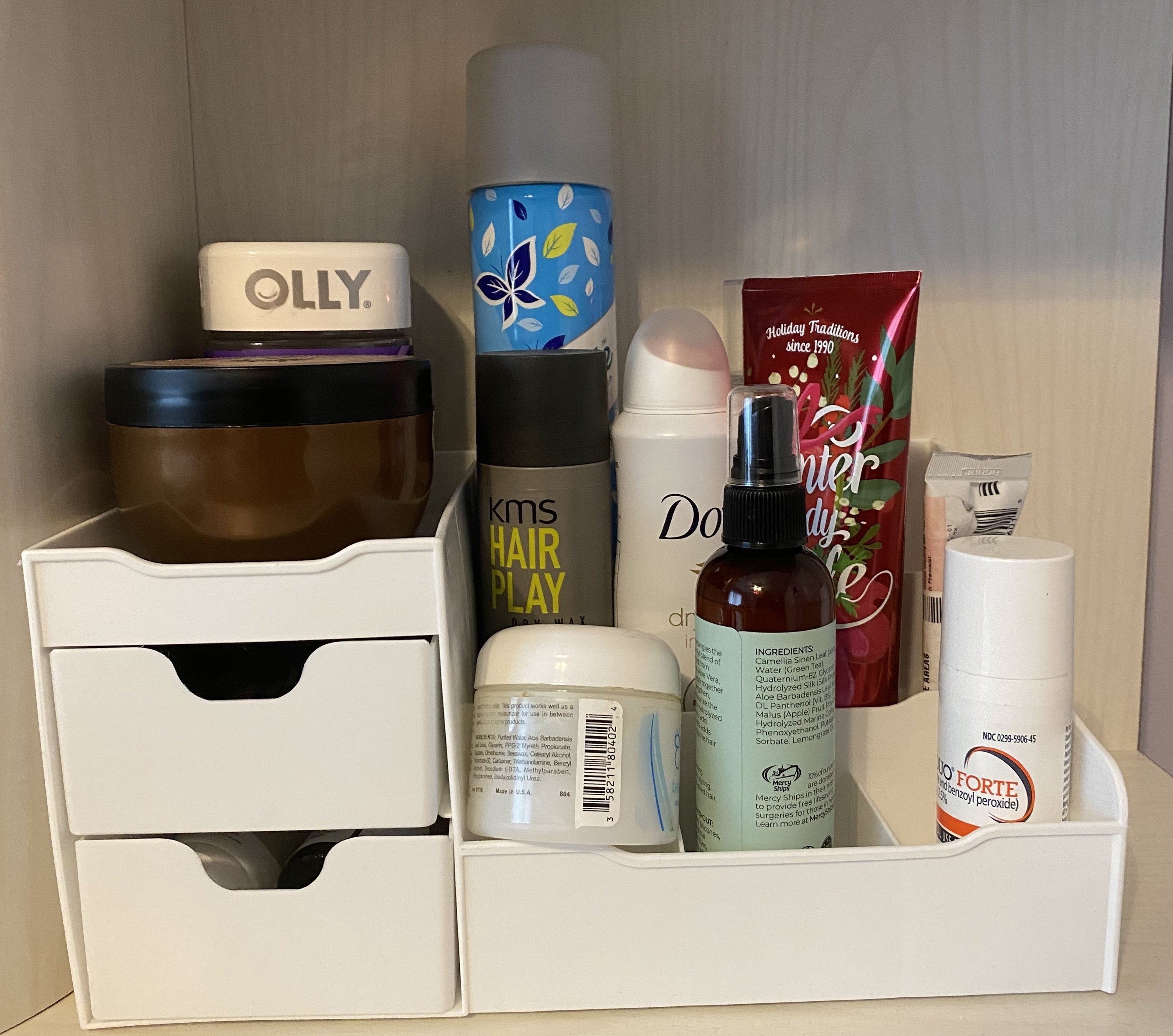The vanity organizer with skincare and hair products on it