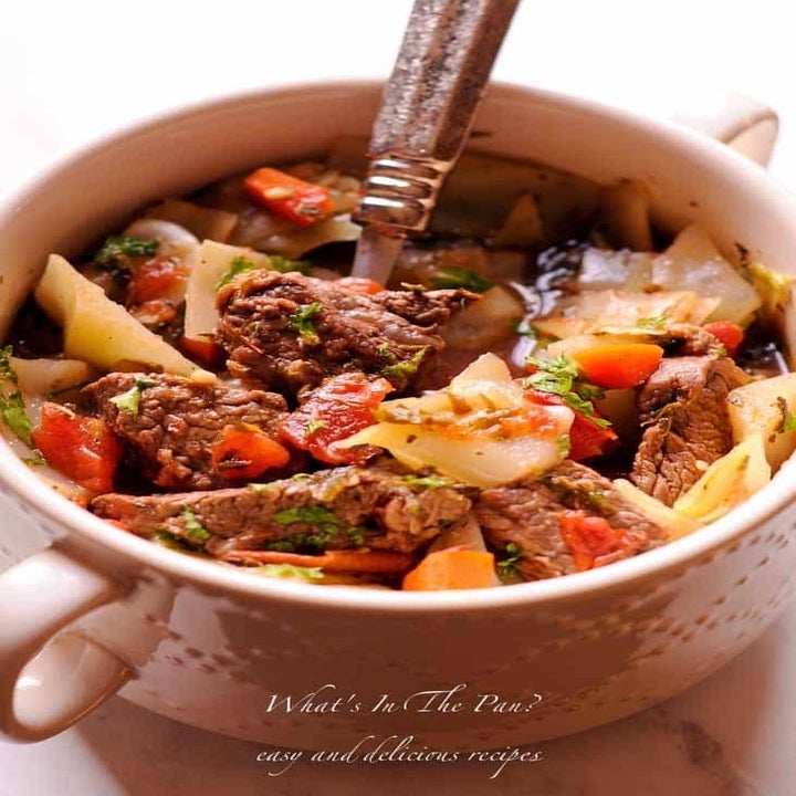 A bowl of cabbage and beef soup.