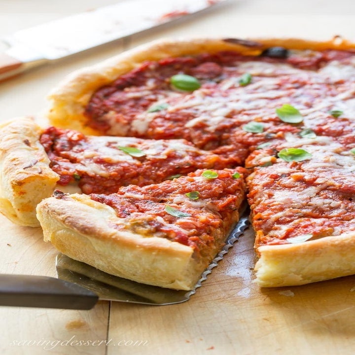 Several slices of deep dish pizza.